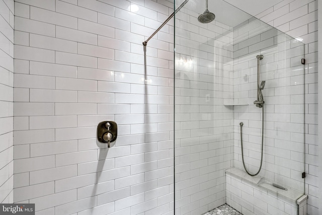 full bath featuring a tile shower