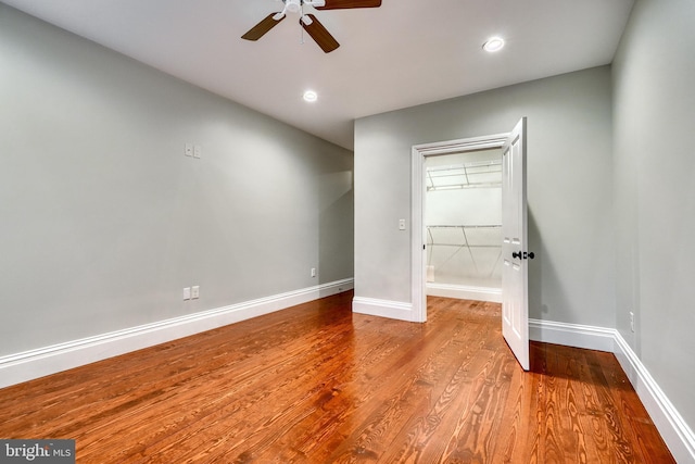 unfurnished bedroom with ceiling fan and light wood-type flooring