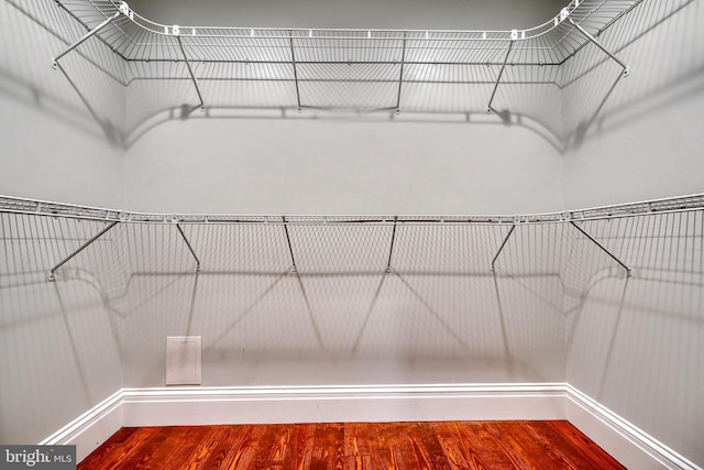 spacious closet with wood finished floors