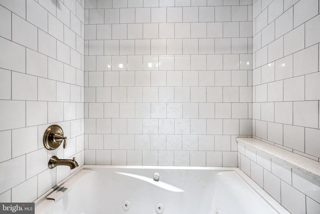 bathroom featuring a washtub