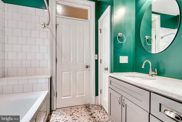 bathroom with vanity and tiled shower / bath combo