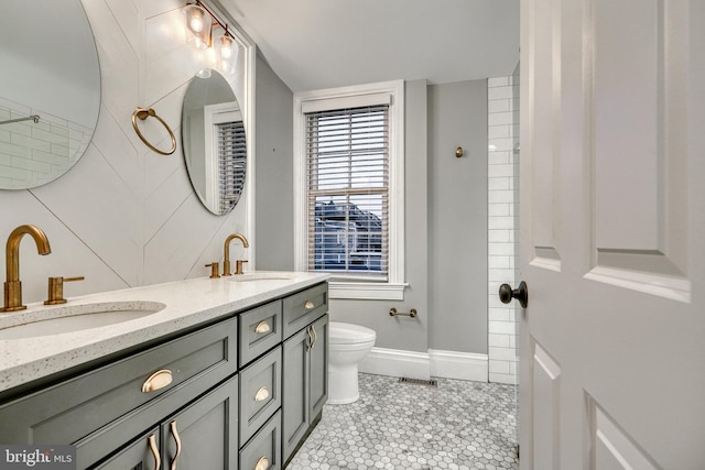 bathroom with tile patterned floors, vanity, and toilet