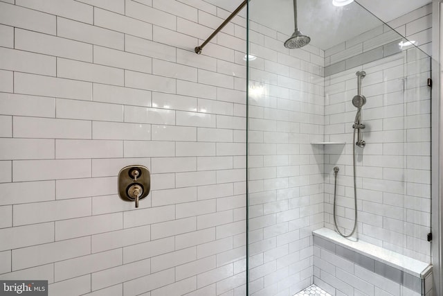 bathroom with tiled shower