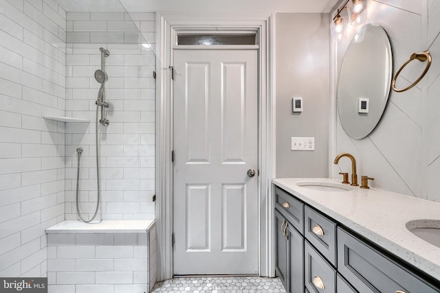 bathroom featuring vanity and a tile shower