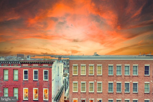 view of outdoor building at dusk