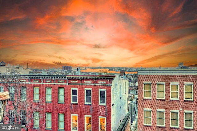 view of outdoor building at dusk