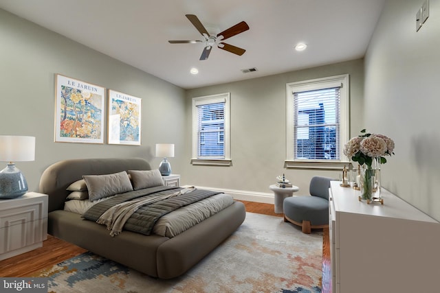 bedroom featuring ceiling fan and light hardwood / wood-style floors