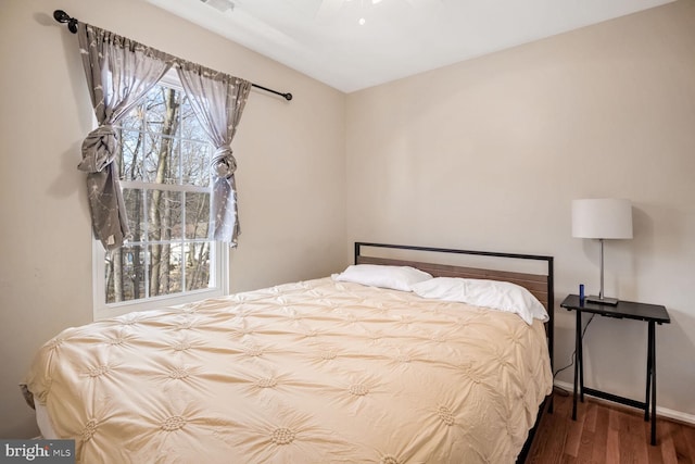 bedroom featuring dark wood-type flooring