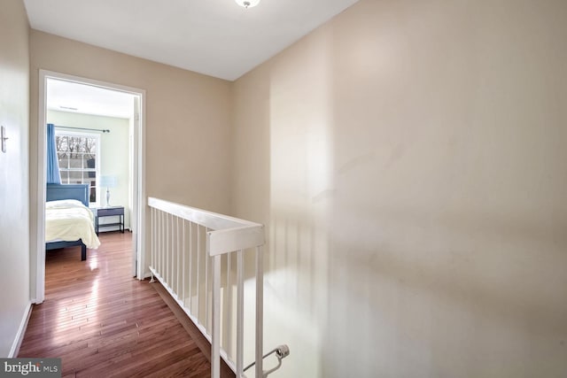 hall with hardwood / wood-style flooring