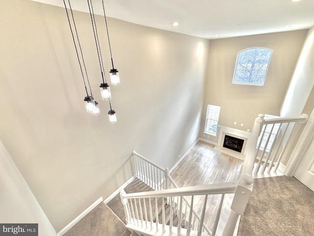 staircase with a towering ceiling