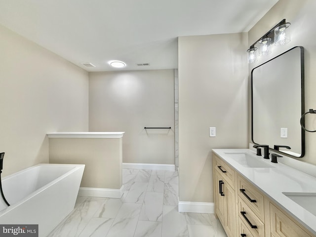 bathroom featuring vanity and a bathing tub