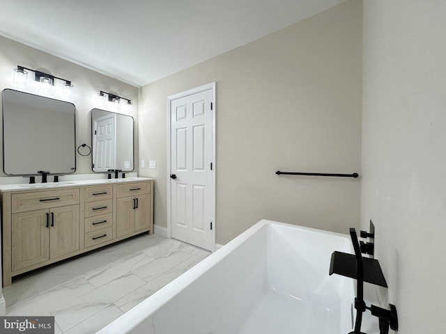 bathroom with vanity and a washtub