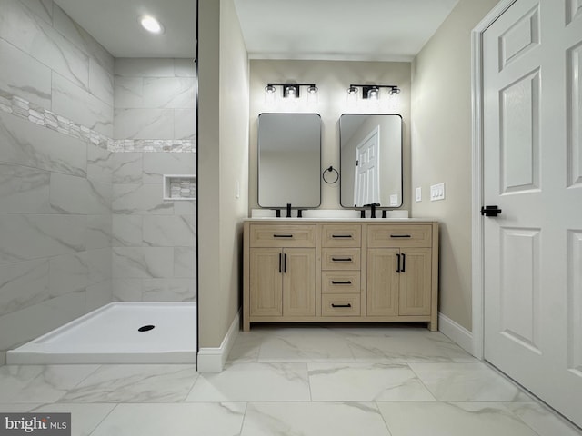 bathroom featuring vanity and a tile shower