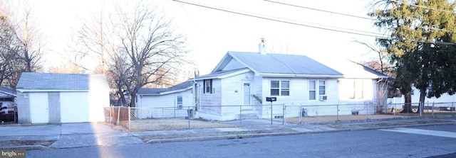 view of front of property with an outdoor structure