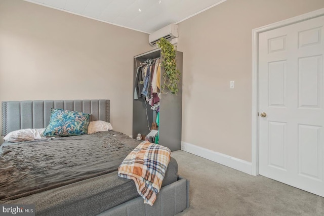 carpeted bedroom featuring a wall mounted air conditioner and a closet