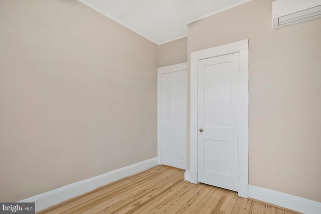 unfurnished bedroom featuring ornamental molding and light wood-type flooring