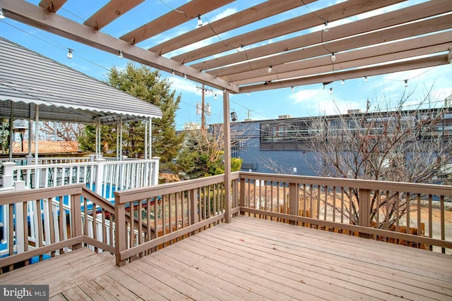 wooden terrace with a pergola