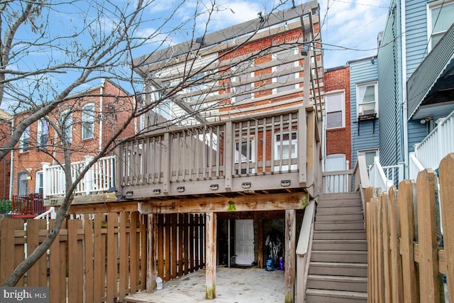 back of house featuring a deck