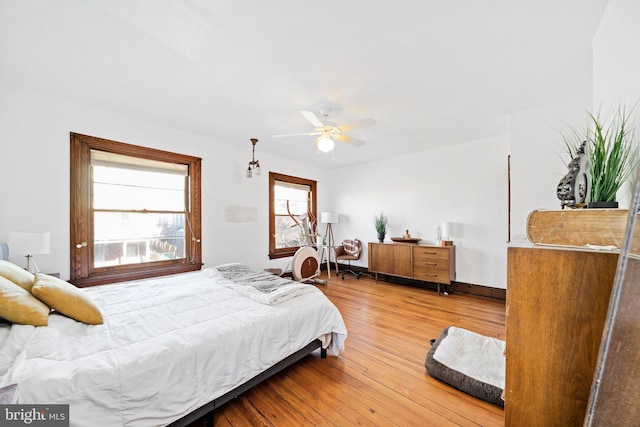 bedroom featuring hardwood / wood-style flooring and ceiling fan