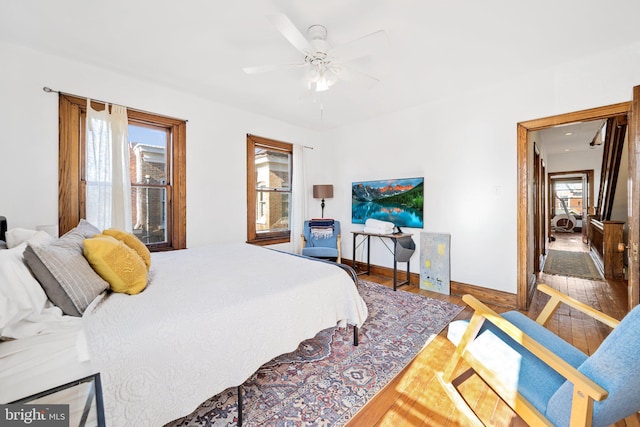 bedroom featuring ceiling fan and hardwood / wood-style floors