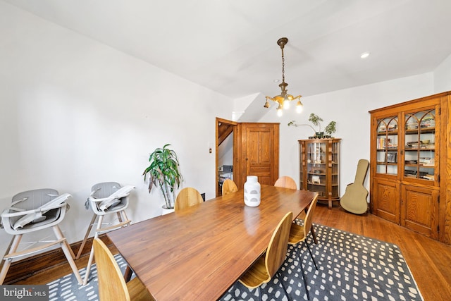 dining room featuring hardwood / wood-style floors and a notable chandelier