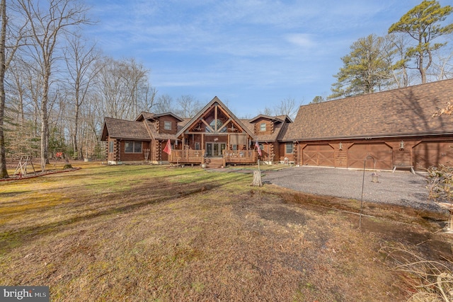 view of front of house with a front lawn and a garage