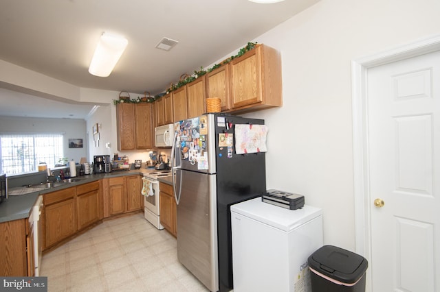 kitchen with sink and white appliances