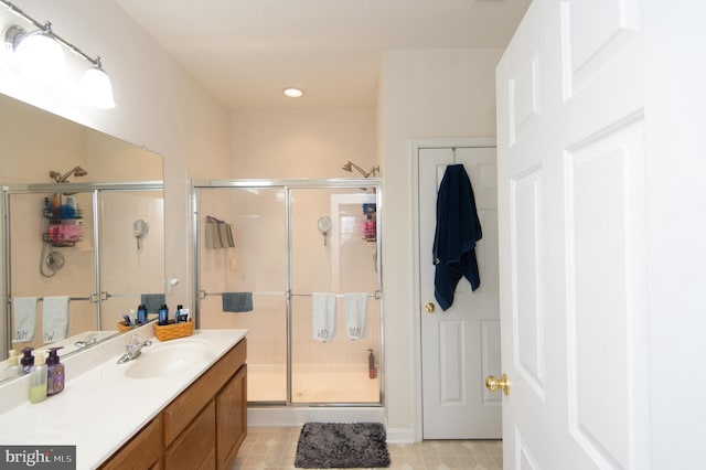 bathroom with vanity and walk in shower