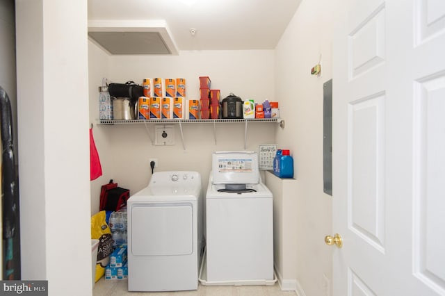 clothes washing area featuring separate washer and dryer