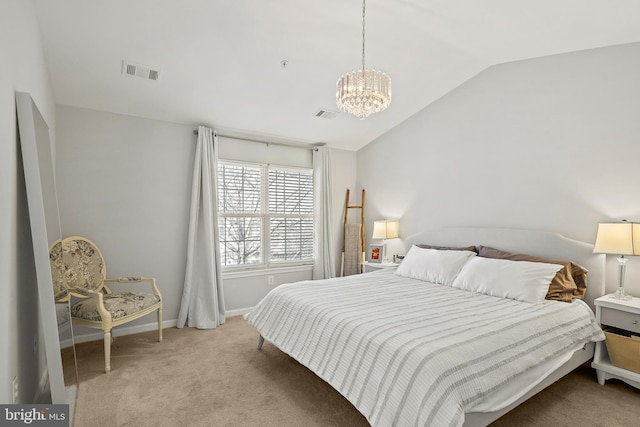 bedroom with a chandelier, vaulted ceiling, and light carpet