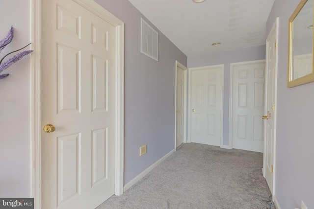 hallway with light carpet