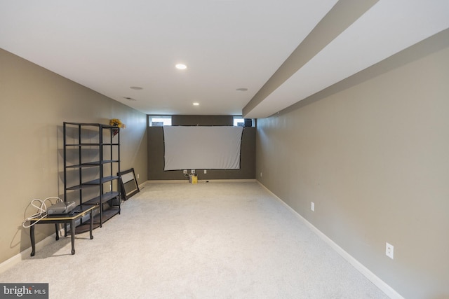 home theater with light colored carpet