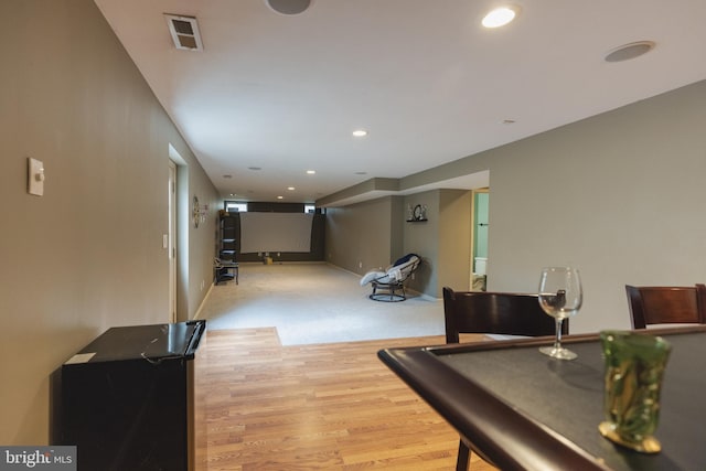 recreation room featuring light hardwood / wood-style floors