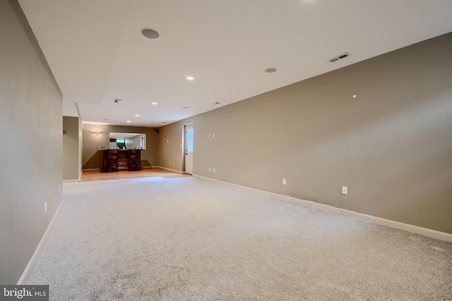 34 Broadbridge Rd, Rosedale, MD 21237 - unfurnished living room featuring light carpet, recessed lighting, and bar area
