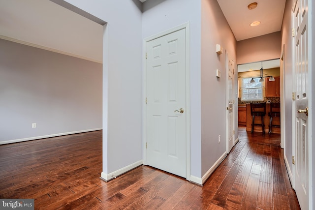 34 Broadbridge Rd, Rosedale, MD 21237 - hallway featuring dark wood-style floors and baseboards