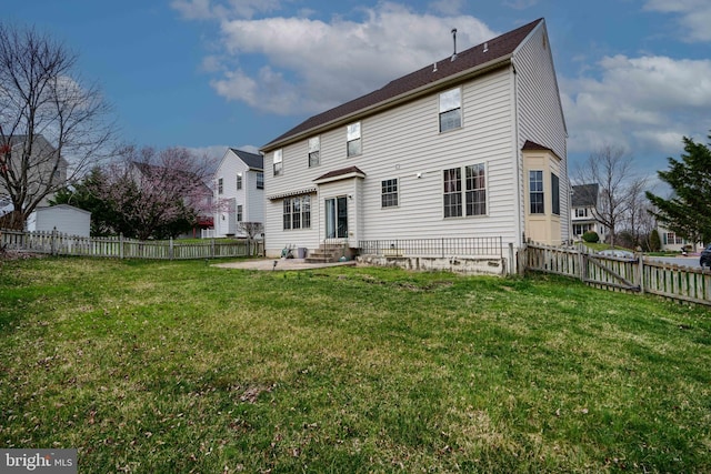 34 Broadbridge Rd, Rosedale, MD 21237 - back of property featuring entry steps, a patio, and a fenced backyard