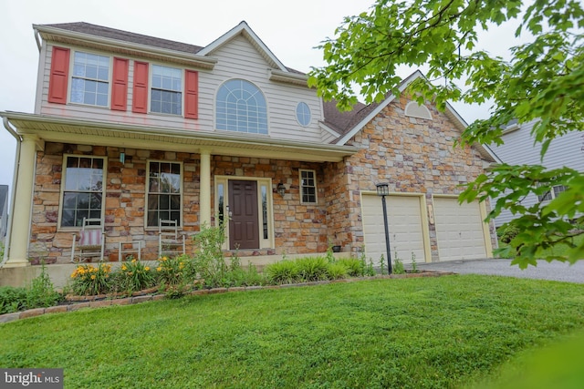34 Broadbridge Rd, Rosedale, MD 21237 - view of front of home with stone siding, driveway, a front yard, and an attached garage