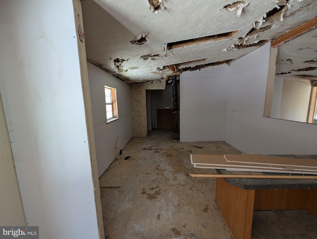 interior space with a textured ceiling