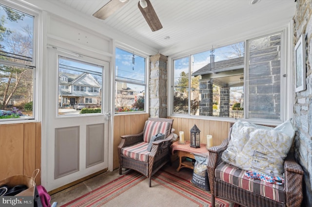 sunroom featuring a healthy amount of sunlight and ceiling fan