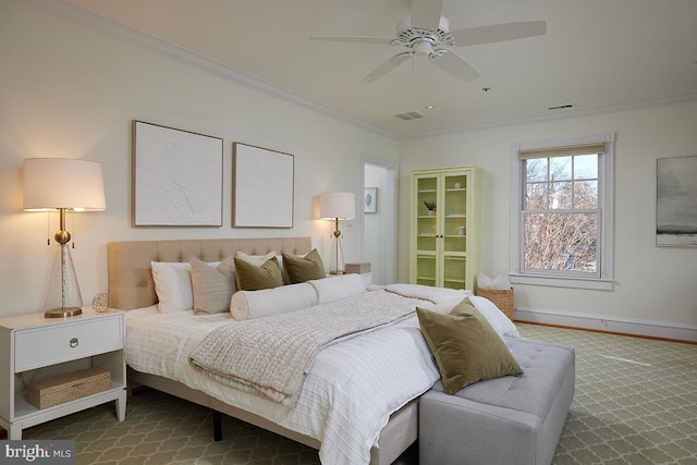 bedroom with a ceiling fan, visible vents, crown molding, and baseboards