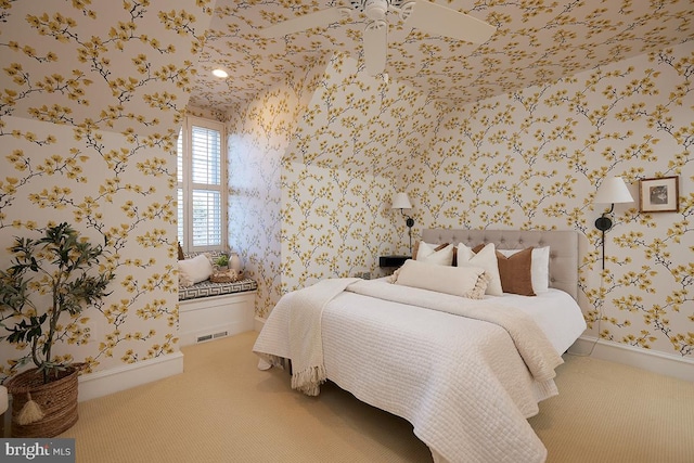 carpeted bedroom featuring visible vents, baseboards, and wallpapered walls