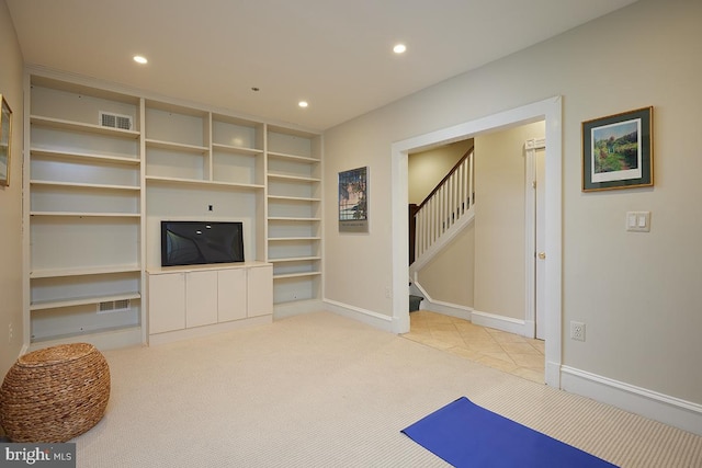 carpeted living area featuring recessed lighting, visible vents, baseboards, and stairs