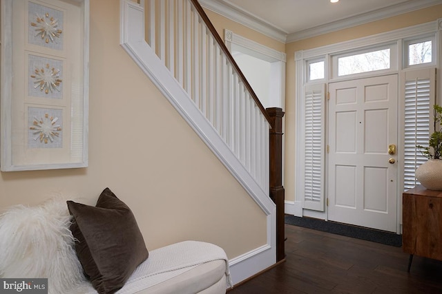 entryway with crown molding and dark wood-type flooring