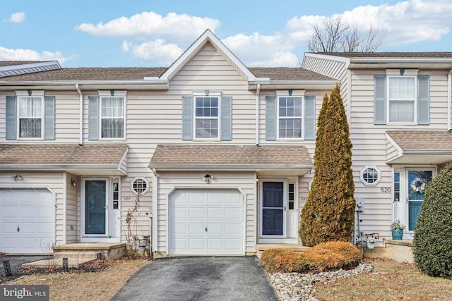 townhome / multi-family property featuring a garage