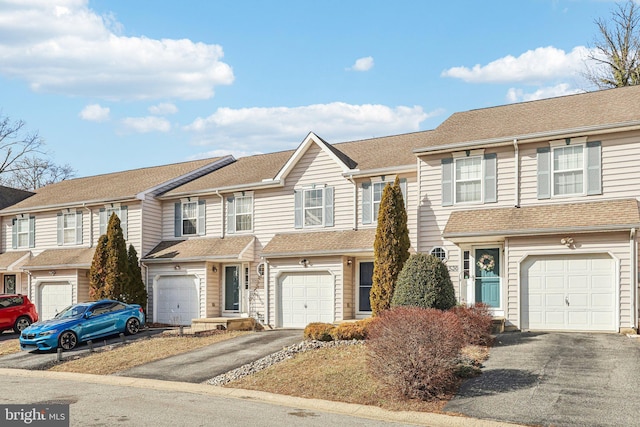 multi unit property featuring a garage