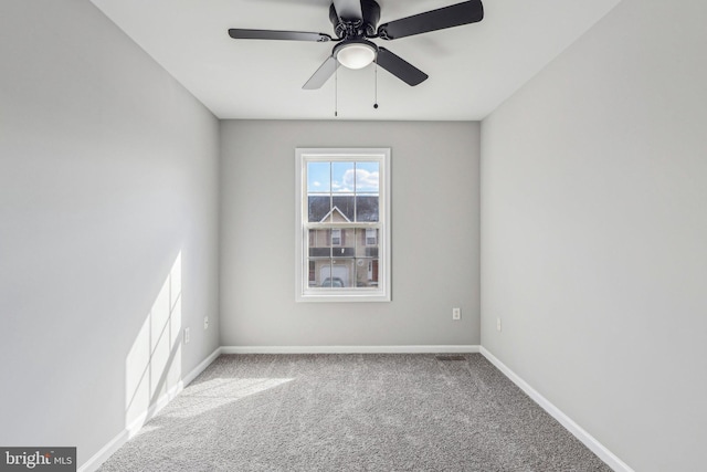 unfurnished room featuring light carpet and ceiling fan