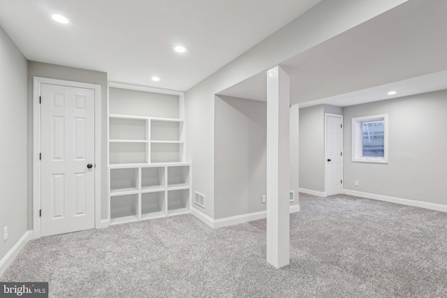 basement with light colored carpet