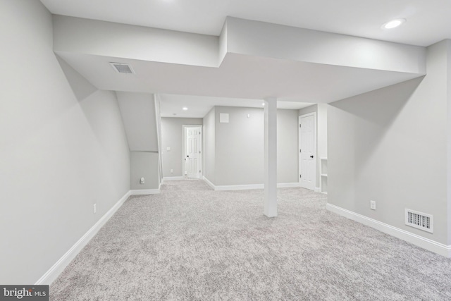 basement with light colored carpet