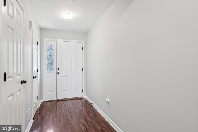 entryway with dark hardwood / wood-style floors