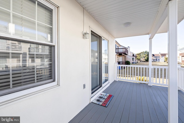 wooden deck featuring covered porch